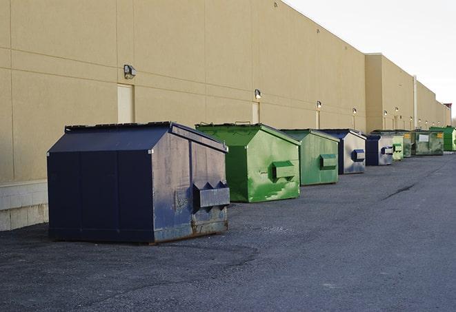 multiple construction dumpsters at a worksite holding various types of debris in Gloucester VA